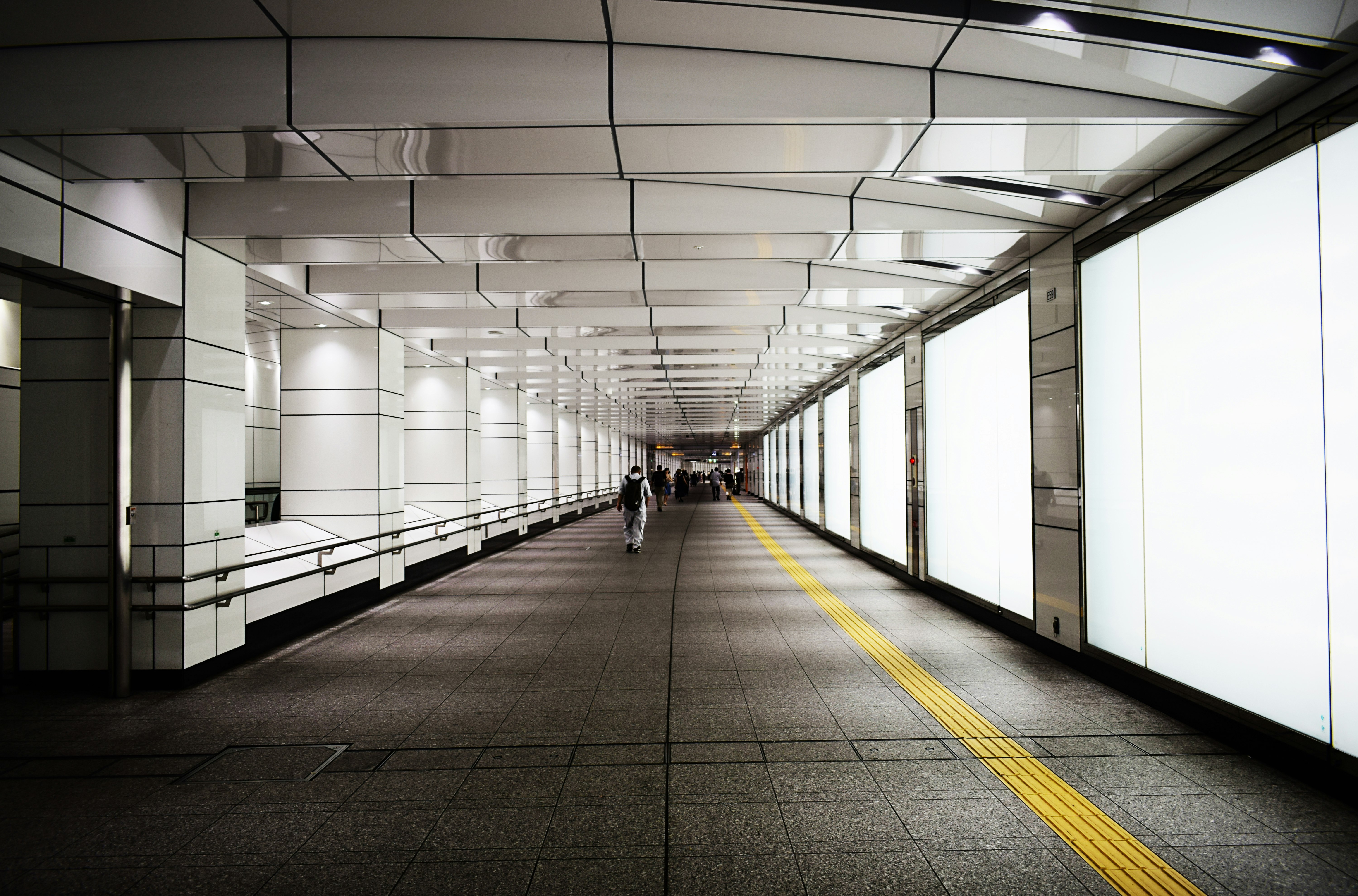 people walking down the subway